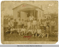 Barefooted children in a class photo from Livingston Elementary School in Livingston Louisiana in 1921
