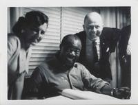 Louis Armstrong with unidentified man and woman