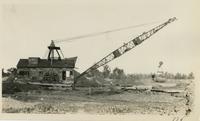 Crane at levee construction site.