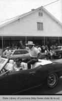 Men in a convertible at the Jambalaya Festival in Gonzales Louisiana in 1971