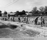 Workmen back filling trench for sanitary sewer line in Ville Platte Louisiana in 1936