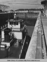 Boat going through navigation locks in Plaquemine Louisiana approximately 1940