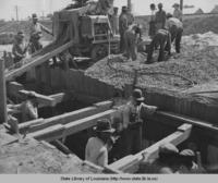 Men working on concrete canal for sewage disposal in Donaldsonville Louisiana in 1937
