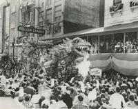 Rex Parade Float "The Giant Lizard" in front of Keller-Zander building, 814 Canal Street