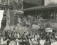 Rex Parade Float "The Voyage Home" in front of Keller-Zander building, 814 Canal Street