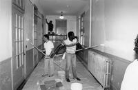 Allen, school repairs, Melvin Bouie, parent, on the right, and two unidentified people, 1988-1989